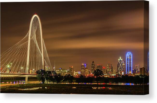 Bridge Canvas Print featuring the photograph Margaret Hunt Hill Bridge and Dallas Skyline at Night by HawkEye Media