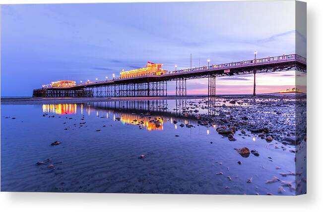 Beach Canvas Print featuring the photograph Reflection of the pier at sunset by Andrew Lalchan