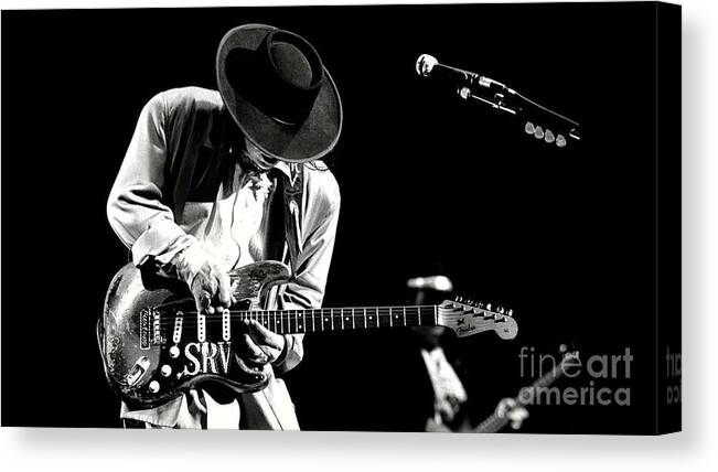 Stevie Ray Vaughan Canvas Print featuring the photograph Stevie Ray Vaughan in concert by Action