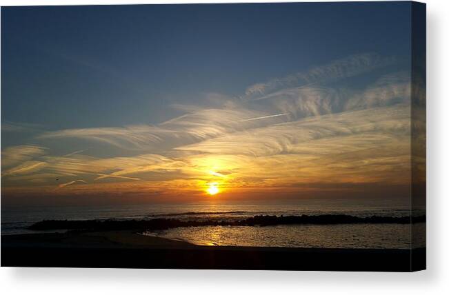 Tranquility Canvas Print featuring the photograph Sunset over the sea by Marcela Santos / FOAP