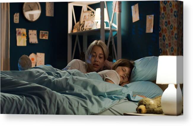 Tranquility Canvas Print featuring the photograph Woman telling story to girl in bed by EvgeniyShkolenko