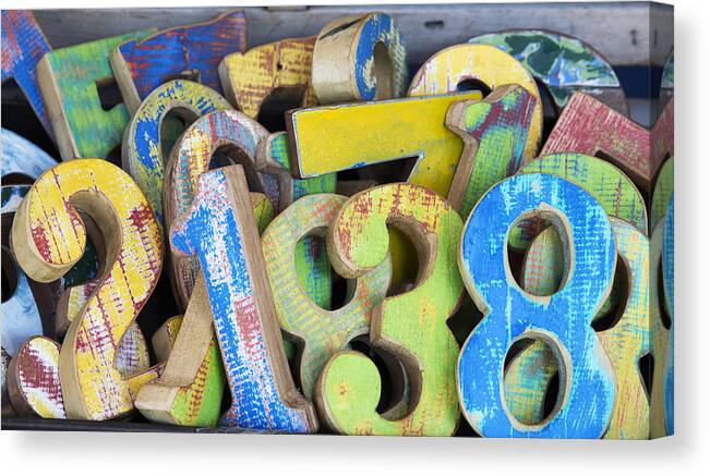 Retail Canvas Print featuring the photograph Wooden numbers. by Grant Faint