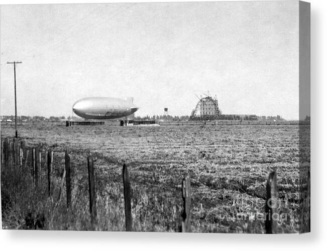  Construction Canvas Print featuring the photograph Hangar One at Moffett Field is one of the world's largest freestanding structures 1932 by Monterey County Historical Society
