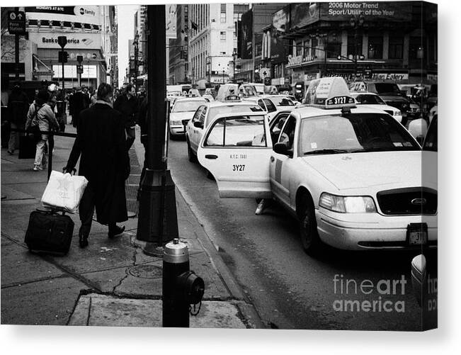 Usa Canvas Print featuring the photograph Yellow Cab On Taxi Rank Outside Madison Square Garden On 7th Avenue New York City Usa by Joe Fox