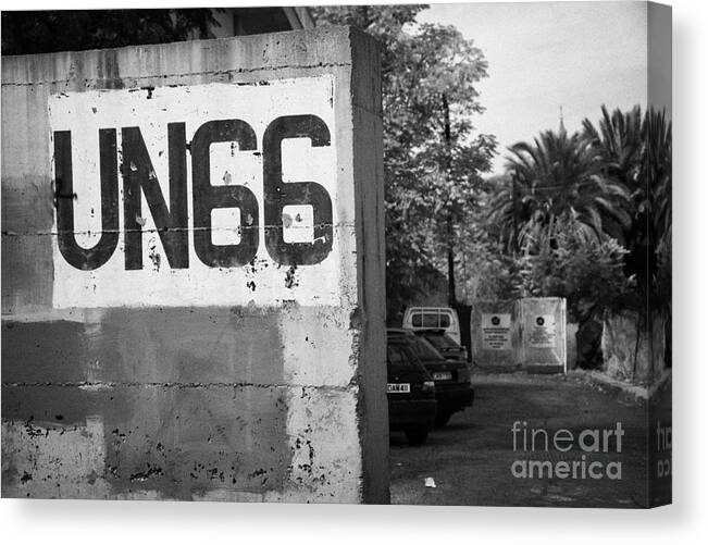 United Canvas Print featuring the photograph UN sector 2 city troop and post UN66 in the restricted area of the UN buffer zone nicosia cyprus by Joe Fox