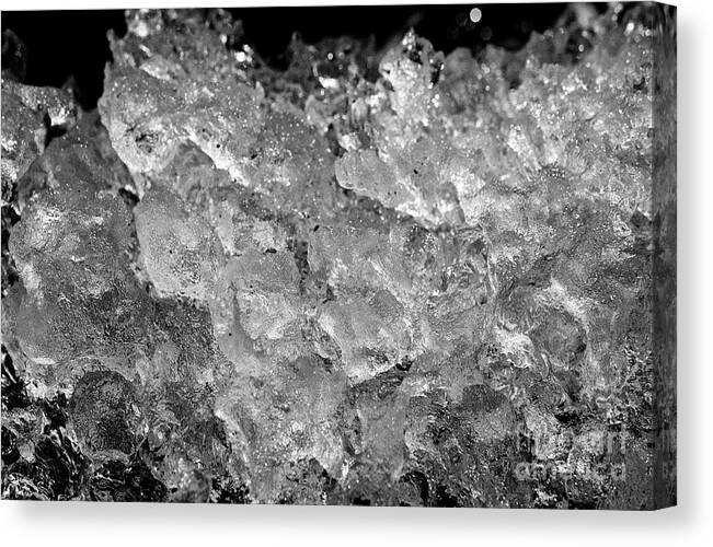 Ice Canvas Print featuring the photograph Ice washed up on black sand beach at jokulsarlon iceland #7 by Joe Fox