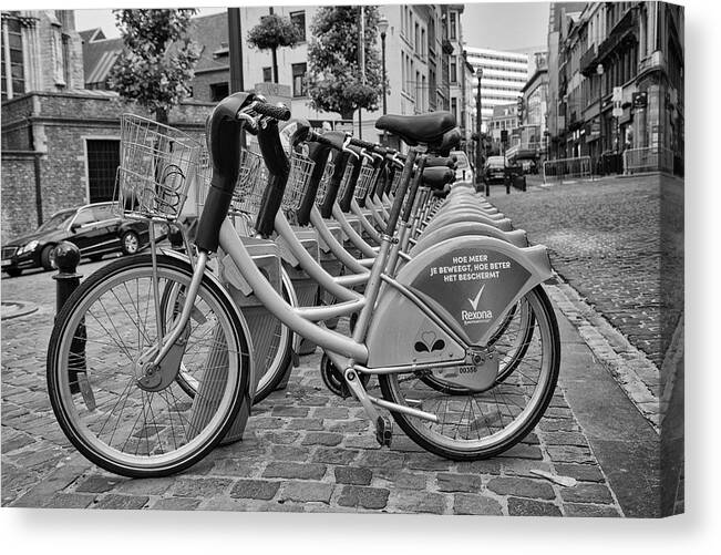 City Bicycles Canvas Print featuring the photograph City Bicycles by Georgia Clare