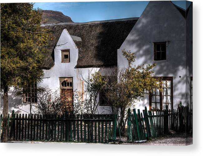 House Canvas Print featuring the photograph Old thatched white house by Claudio Maioli