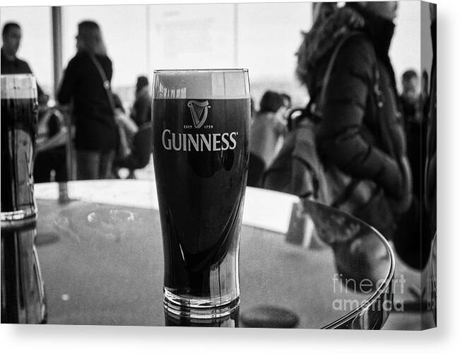 Guinness Canvas Print featuring the photograph pint of guinness in the gravity bar guinness storehouse dublin Ireland by Joe Fox