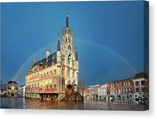 Gouda Canvas Print featuring the photograph Rainbow over Town Hall Gouda by Casper Cammeraat