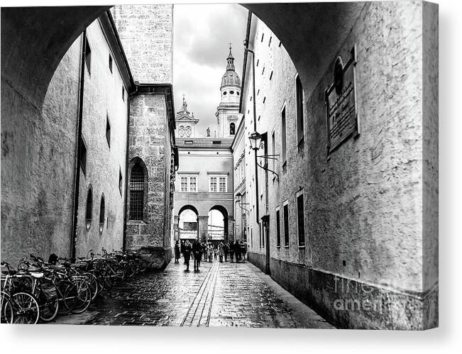 Cobblestone Walk In Salzburg Canvas Print featuring the photograph Salzburg Cobblestone Walk by John Rizzuto