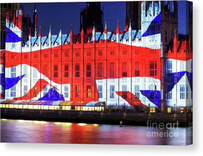 Union Jack On The Palace Of Westminster Canvas Print featuring the photograph Union Jack on the Palace of Westminster in London by John Rizzuto