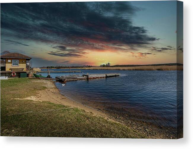Photography Canvas Print featuring the photograph Fishermen House And Pier At Sunset Delta ..Jurmala by Aleksandrs Drozdovs