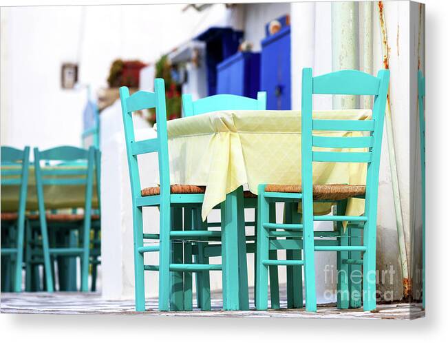 Cafe Colors Canvas Print featuring the photograph Mykonos Town Cafe Chair Colors in Greece by John Rizzuto
