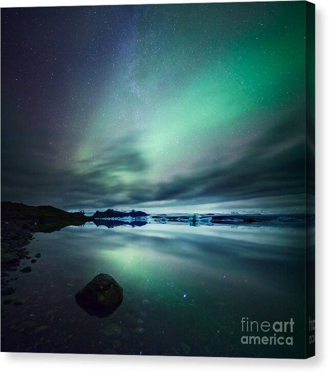 Aurora Canvas Print featuring the photograph Aurora borealis Northern lights over glacial lagoon in Iceland #3 by Matteo Colombo