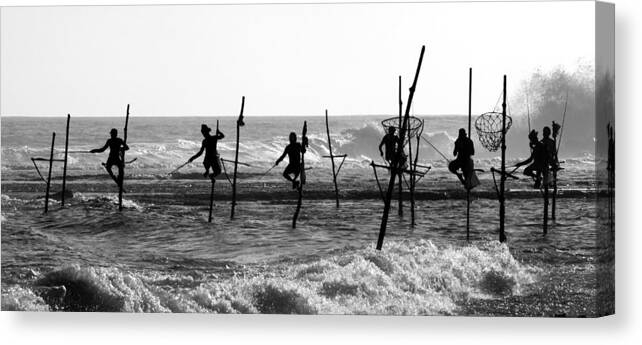 Fisherman Canvas Print featuring the photograph The Stick Fishermen by Yaniv Guy