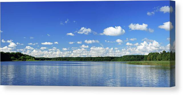 Water's Edge Canvas Print featuring the photograph Cumulus Clouds Over Lake by Avtg