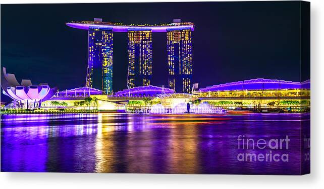 Singapore Canvas Print featuring the photograph Singapore waterfront by night #1 by Benny Marty
