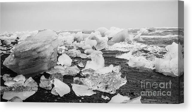 Arctic Canvas Print featuring the photograph Giant ice blocks detached from icebergs on the coast of an Icelandic beach. #10 by Joaquin Corbalan