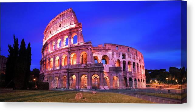 Arch Canvas Print featuring the photograph Italy, Rome, The Colosseum Illuminated by Travelpix Ltd