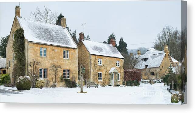 Stanton Canvas Print featuring the photograph Cotswold Stone Cottages in the Winter Snow in Stanton by Tim Gainey