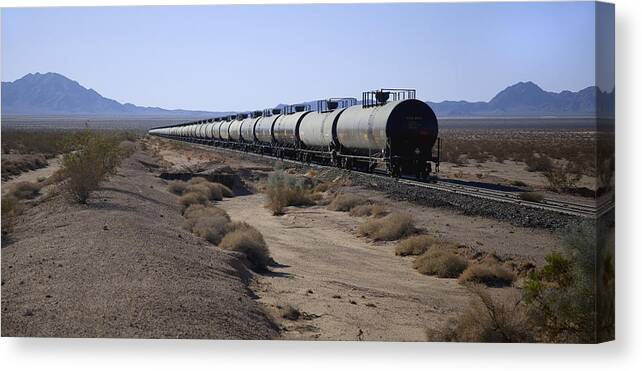 California Canvas Print featuring the photograph Tanker cars on railroad tracks; mountains beyond by Timothy Hearsum