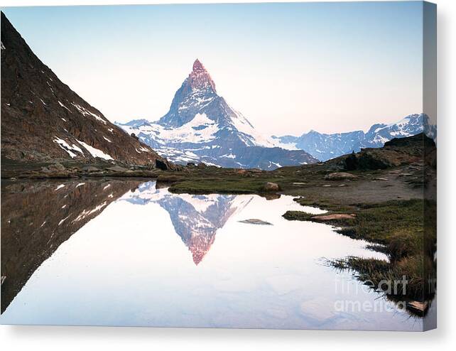 Dawn Canvas Print featuring the photograph First light on the Matterhorn by Matteo Colombo