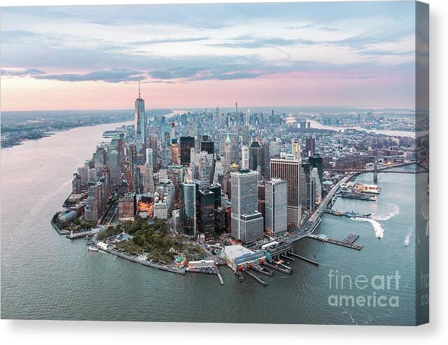 New York City Canvas Print featuring the photograph Aerial of lower Manhattan peninsula at sunset, New York, USA by Matteo Colombo
