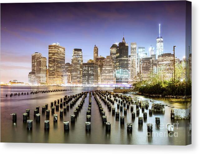 New York Canvas Print featuring the photograph Lower Manhattan skyline reflected in the East river at dusk, New by Matteo Colombo