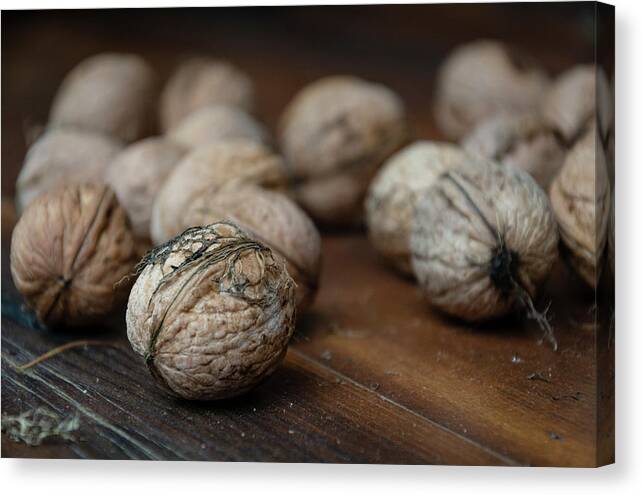 Nuts Canvas Print featuring the photograph Nuts on a wooden table by Martin Vorel Minimalist Photography