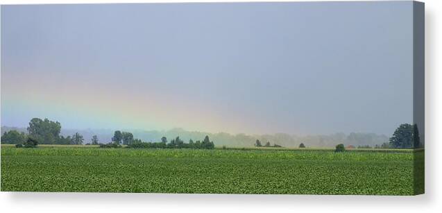 Nature Canvas Print featuring the photograph Caught in the Rainbow by Peggy King