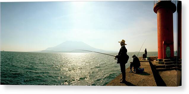 Photography Canvas Print featuring the photograph Men Fishing In Sakurajima Island by Panoramic Images