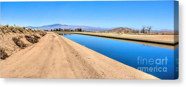 Antelope Valley Canvas Print featuring the photograph Aqueduct and the Tehachapi Mountains by Joe Lach