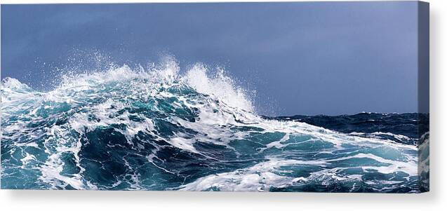 Scenics Canvas Print featuring the photograph Breaking Wave On A Rough Sea Against #1 by Mike Hill