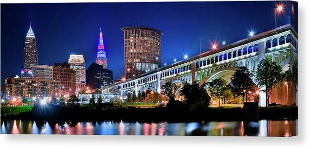 Cleveland Canvas Print featuring the photograph Stretching out on a Colorful Night by Frozen in Time Fine Art Photography