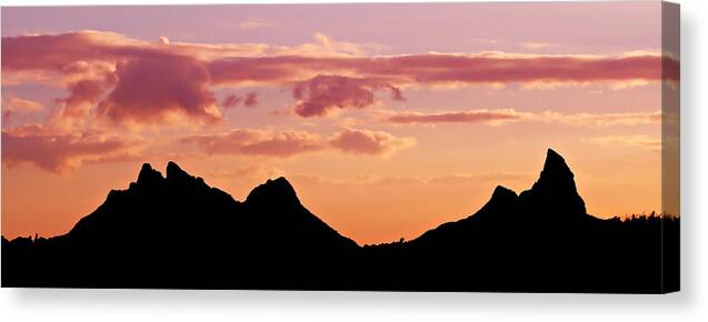 Mountains Canvas Print featuring the photograph Mountains Silhouette at Sunset - Mauritius by Barry O Carroll