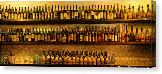 Wine Bottles Canvas Print featuring the photograph Trattoria by John Galbo