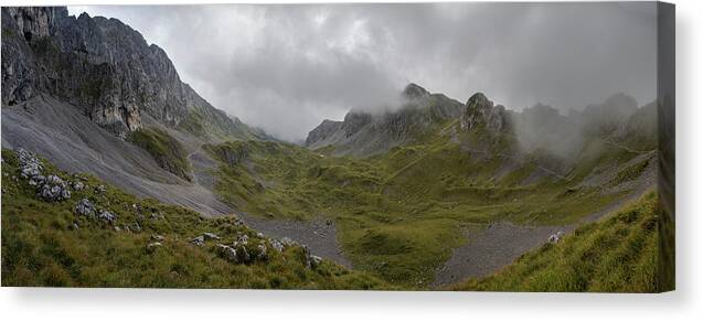 Panoramic Canvas Print featuring the photograph Panoramic view in high mountain with clouds approaching, Preasolana by Nicola Aristolao