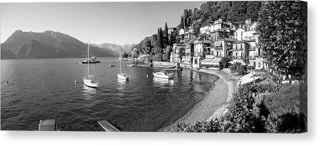 Architecture Beach Boat Building Exterior Black And White Image Evening Horizontal Italy Lake Como Lecco Lombardy Mountain No People Outdoors Photography Sky Tourism Town Transportation Travel Destinations Vacations Varenna Waterfront Nautical Vessel Canvas Print featuring the photograph Early evening view of waterfront at Varenna, Lake Como, Lombardy, Italy by Panoramic Images