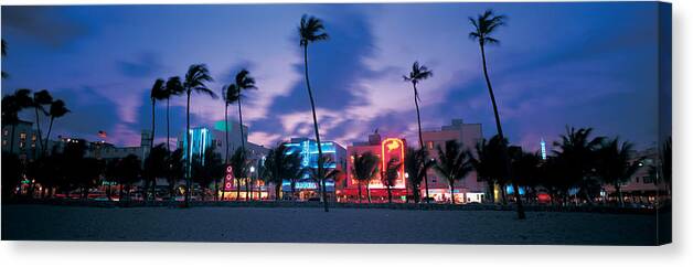Photography Canvas Print featuring the photograph Buildings Lit Up At Dusk, Miami by Panoramic Images