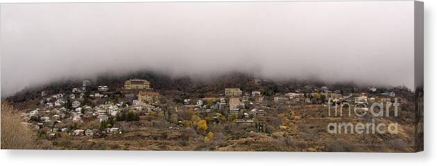 Jerome Canvas Print featuring the photograph Jerome Arizona beneath the clouds by Ron Chilston