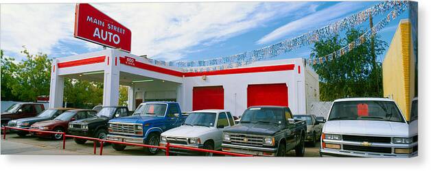 Photography Canvas Print featuring the photograph Trucks In Used Car Lot, Roswell, New by Panoramic Images
