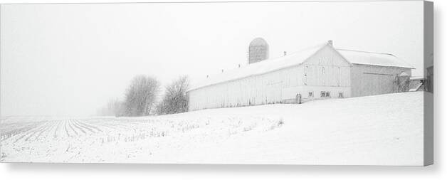 Barn Canvas Print featuring the photograph Fade to White - Vanishing point perspective of WI barn in blizzard by Peter Herman