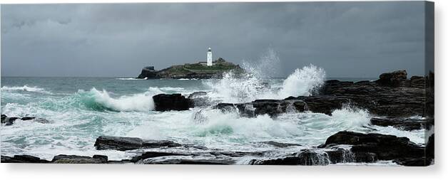 Devon Canvas Print featuring the photograph Godrevy Lighthouse Storm Waves Cornwal South west coast path by Sonny Ryse