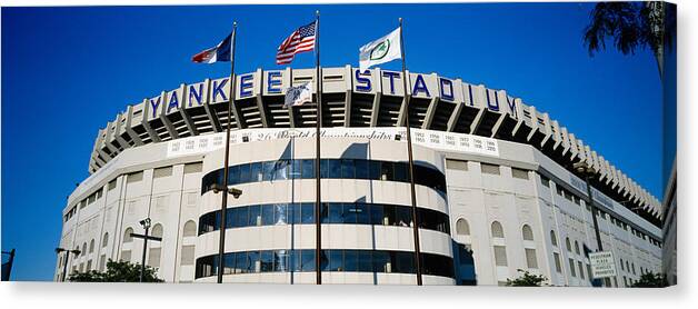 Photography Canvas Print featuring the photograph Flags In Front Of A Stadium, Yankee #1 by Panoramic Images