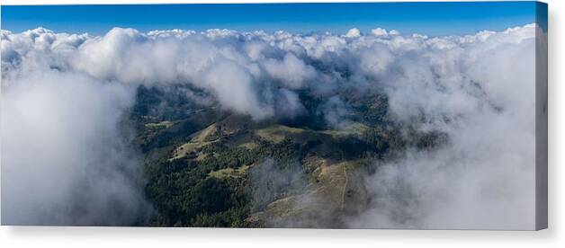 Landscapeaerial Canvas Print featuring the photograph Clouds Drift Above The Mixed Evergreen by Ethan Daniels