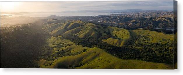 Landscapeaerial Canvas Print featuring the photograph Sunlight Illuminates The Green Hills by Ethan Daniels