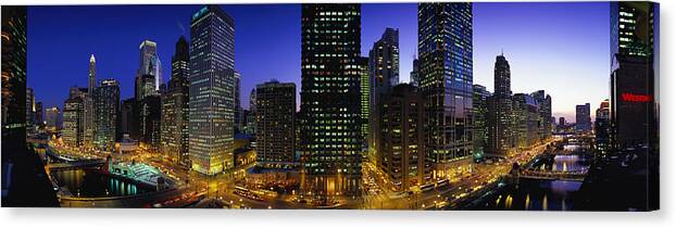 Photography Canvas Print featuring the photograph Buildings Lit Up At Dusk, Chicago #1 by Panoramic Images