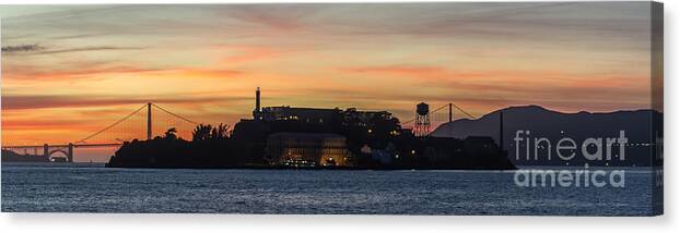 Alcatraz Island Canvas Print featuring the photograph Alcatraz Island and Golden Gate Bridge at Sunset by David Oppenheimer