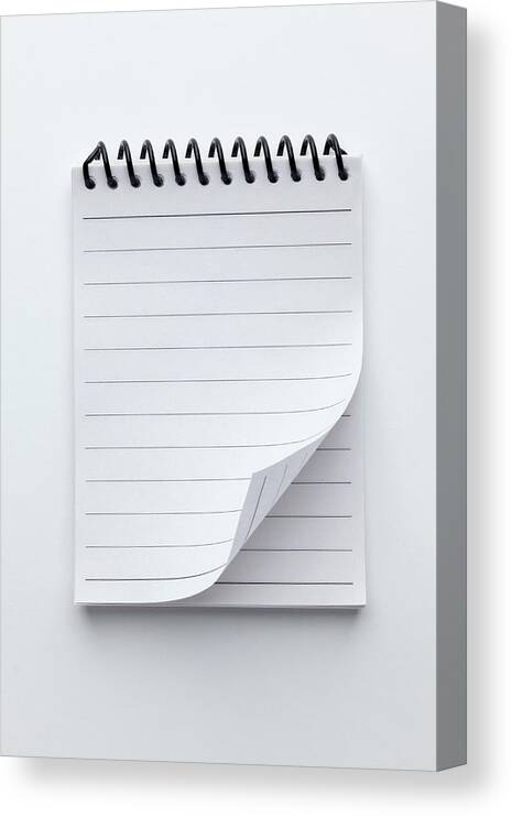 Shadow Canvas Print featuring the photograph A Spiral Notepad With Lined Paper And A #1 by Caspar Benson